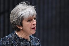May accuses EU of influencing UK election, lashes out at media