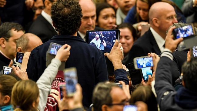 Pope Francis says “lift up our hearts doesn’t mean lift up our mobile phones to take photographs”