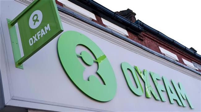 Oxfam to cut projects, staff after Haiti sex scandal