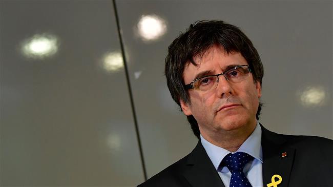 Spain drops arrest warrant for Puigdemont after Germany refuses to extradite him