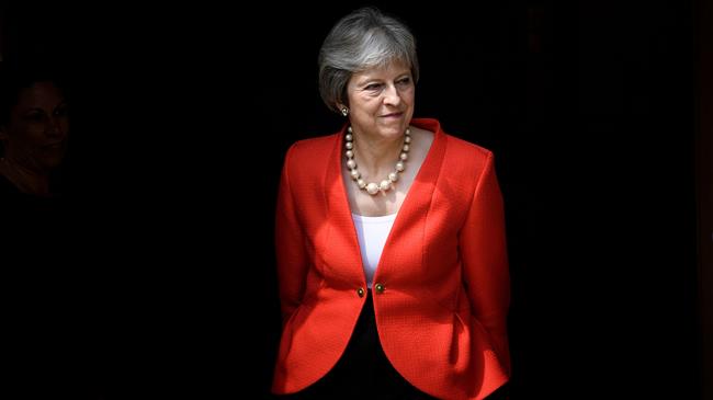 Britain’s May narrowly avoids customs union vote defeat