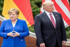 Trump, Merkel meet at NATO summit after US president slams Germany