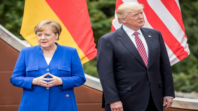 Trump, Merkel meet at NATO summit after US president slams Germany