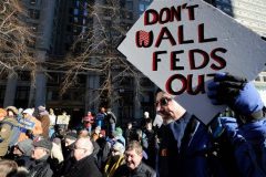 US: Thousands of federal workers miss first paycheck of year