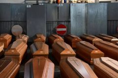 Italy’s dead overwhelm morgues as virus toll tops 8,000