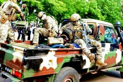 The assailant seen lying in an army vehicle Man accused of trying to assassinate Malian president dies in custody