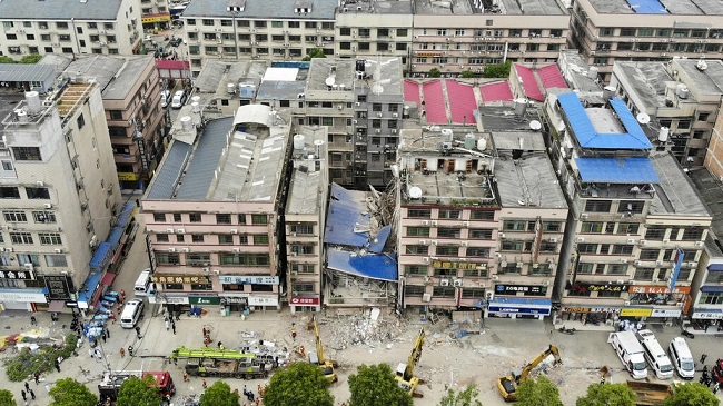 Dozens trapped in China building collapse
